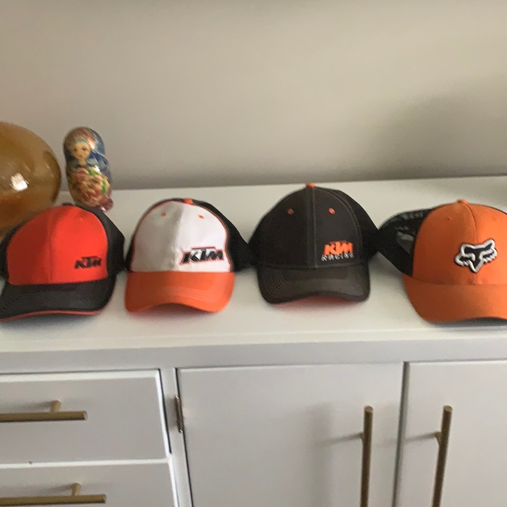 4 KTM motocross hats.